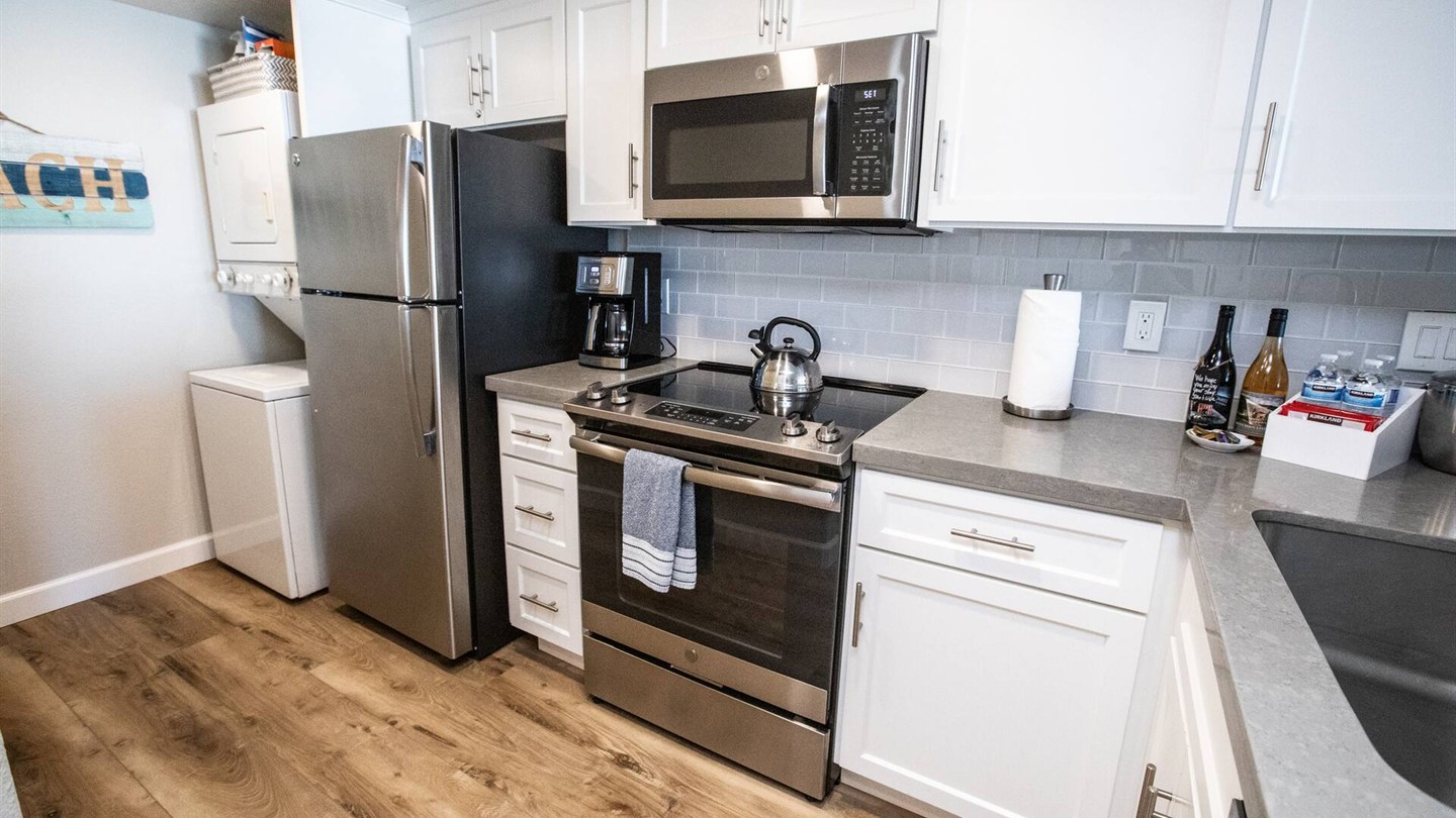 Well-equipped Unit 52 kitchen with stainless appliances
