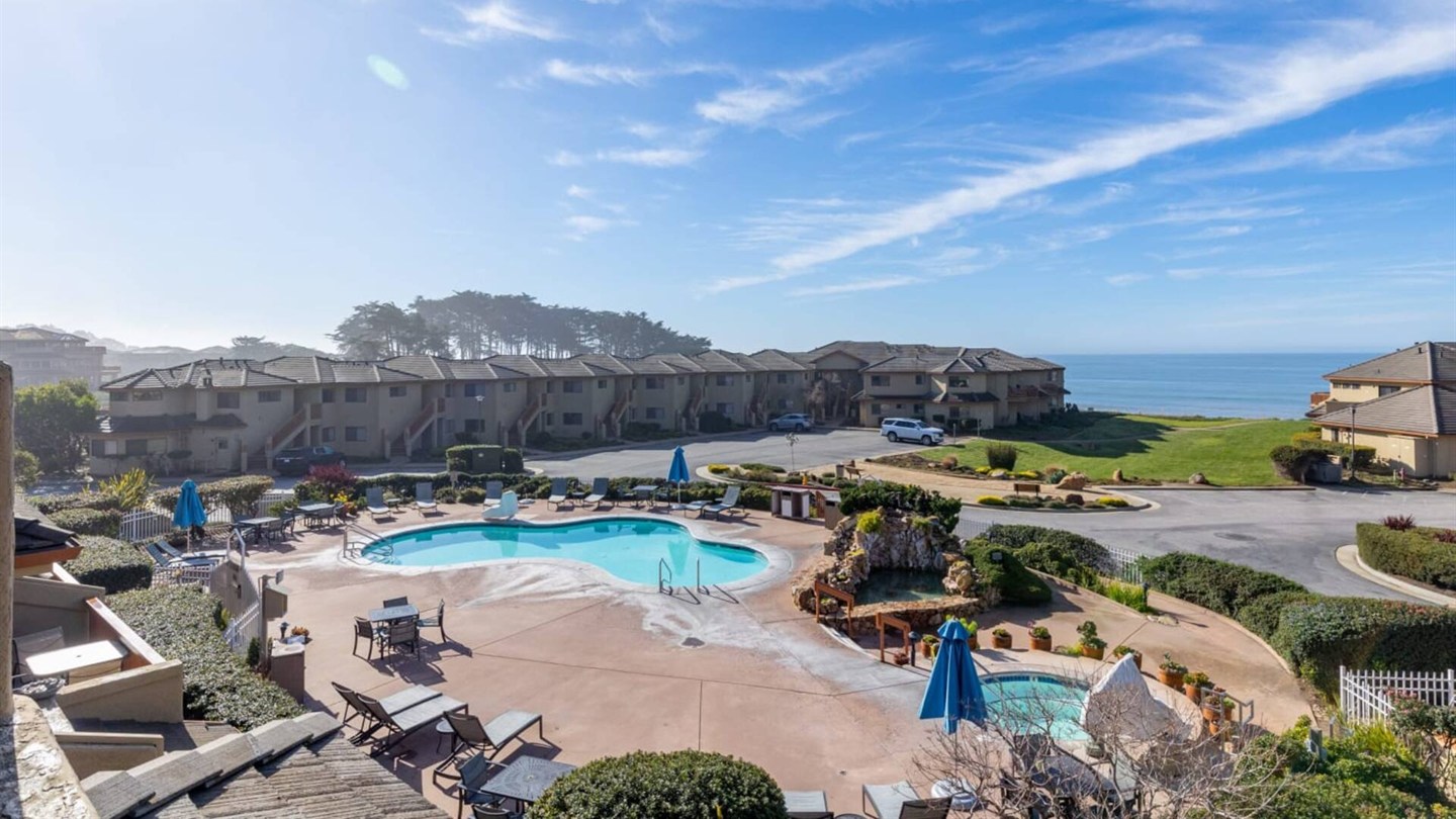 Shared North Bluff heated pool and hot tub with ocean views